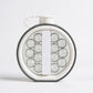 Round container with geometric design on a white background