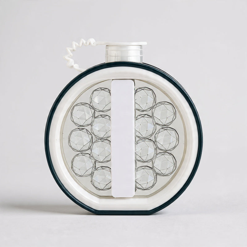 Round jewelry display with clear stones on a white background