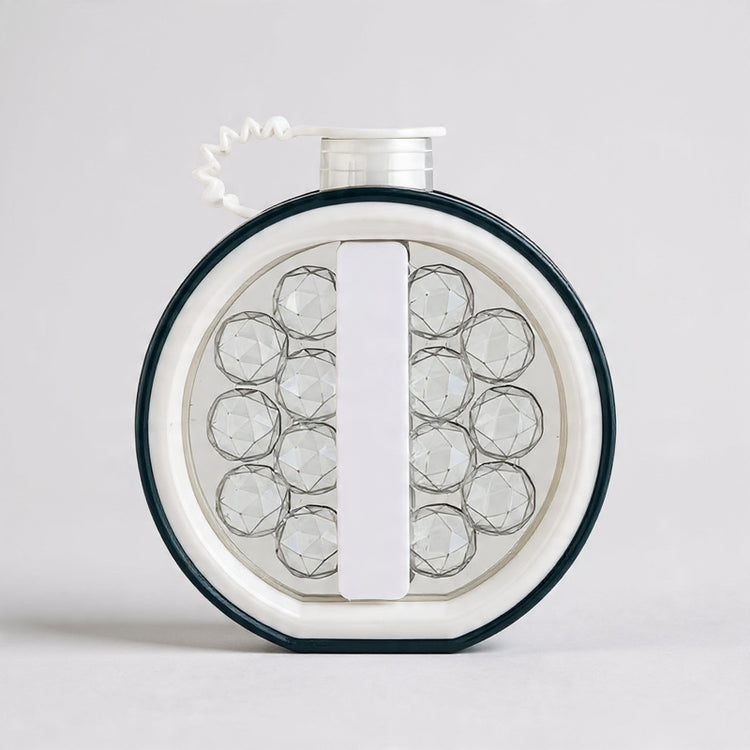 Round jewelry display with clear stones on a white background