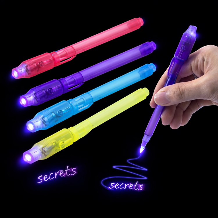 Set of colorful glow pens with a hand holding a purple pen on a black background.