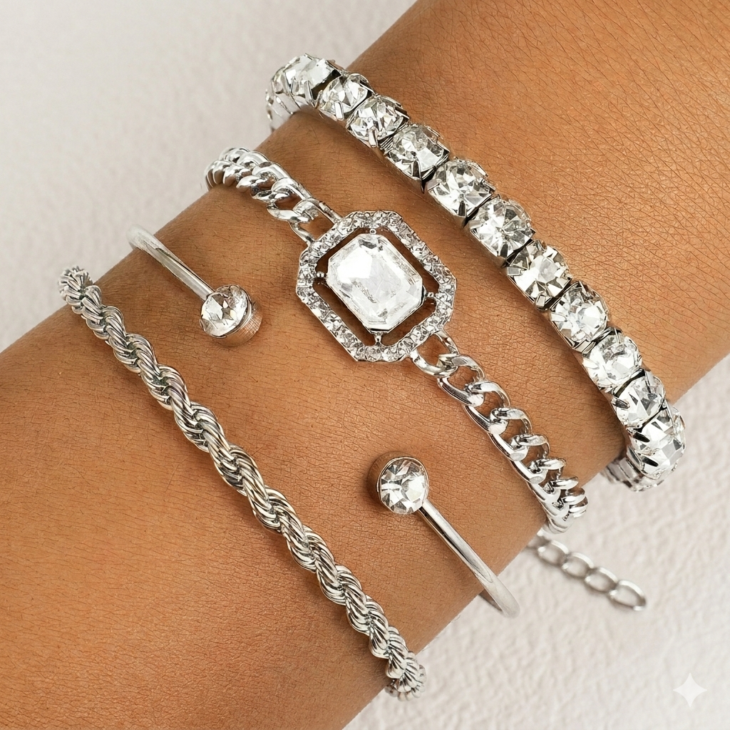 Set of silver bracelets with various designs on a white background