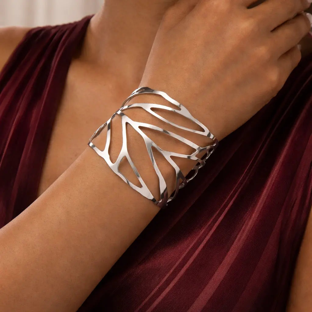 Design leaf bracelet for women vintage alloy jewelry silver color worn by a model in a red dress