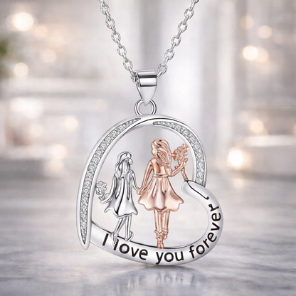 Silver necklace with a pendant featuring two girls and &