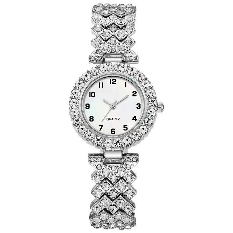 Silver watch with a decorative band on a white background