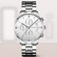 Silver wristwatch with a detailed face on a light gray background