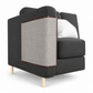 Modern gray armchair with a textured backrest on a white background