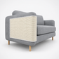 Gray sofa with a textured white panel on a white background