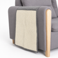 Gray armchair with a textured beige cushion on a white background