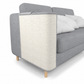 Gray sofa with a textured white panel on a white background