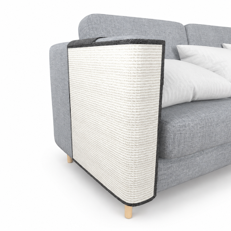Gray sofa with a cat scratcher in front on a white background