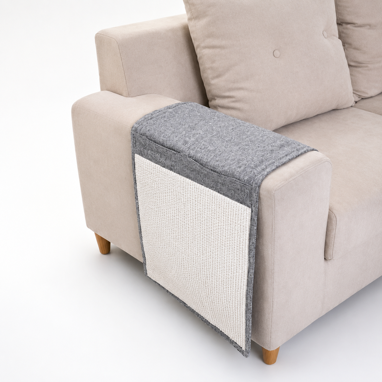 Gray and white pet bed on a beige sofa
