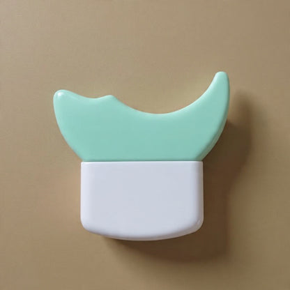 Small container with a green lid and white base on a beige background
