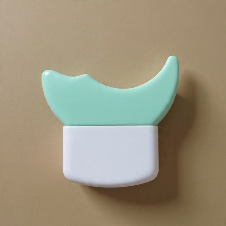 Small container with a green lid and white base on a beige background