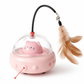 Pink cat-shaped toy with a transparent dome and feather attachment on a white background