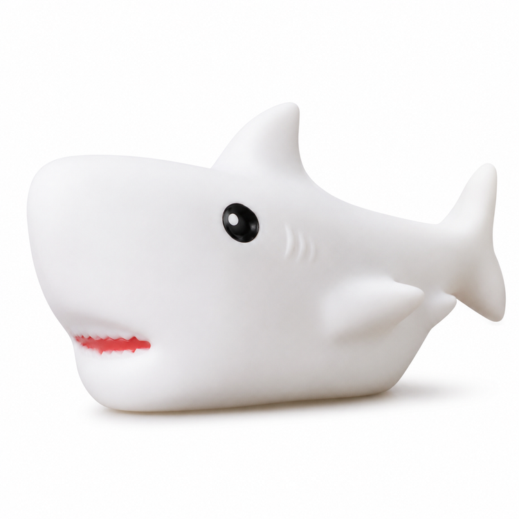 White shark-shaped object with black eyes and red mouth on a white background