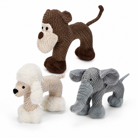 Three knitted animal toys on a white background