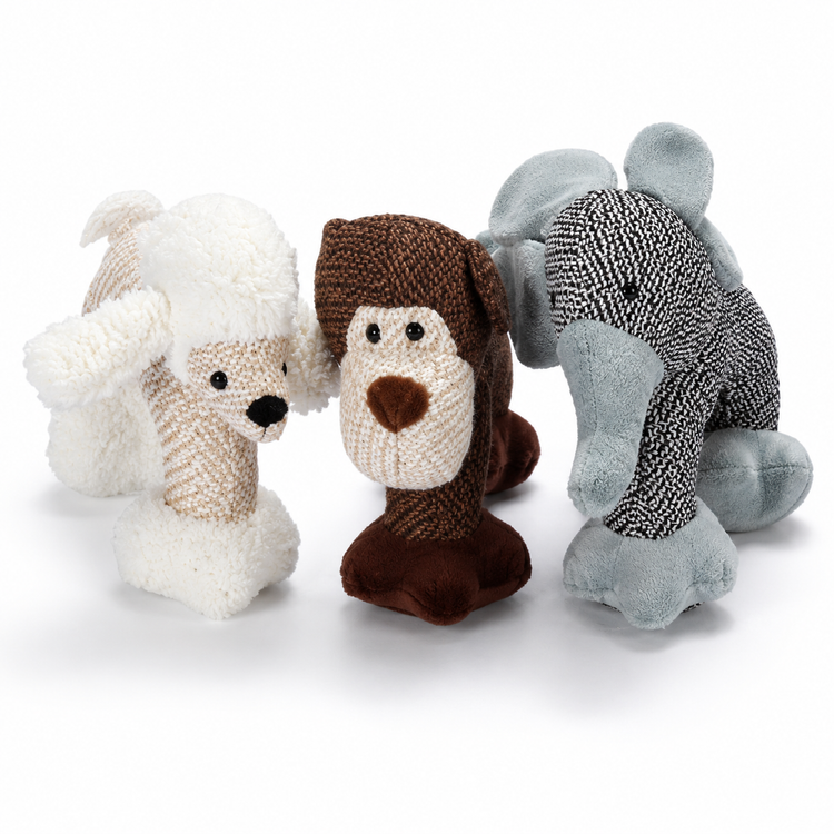 Three knitted dog toys in white, brown, and gray on a white background