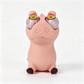 A novelty pig figurine with oversized, bulging eyeballs, photographed against a seamless white studio background.