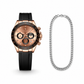 Luxury watch with black strap and rose gold case, accompanied by a silver chain on a white background.