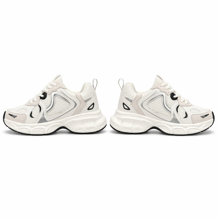 Pair of white sneakers with black accents on a white background