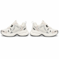 Pair of white sneakers with black accents on a white background