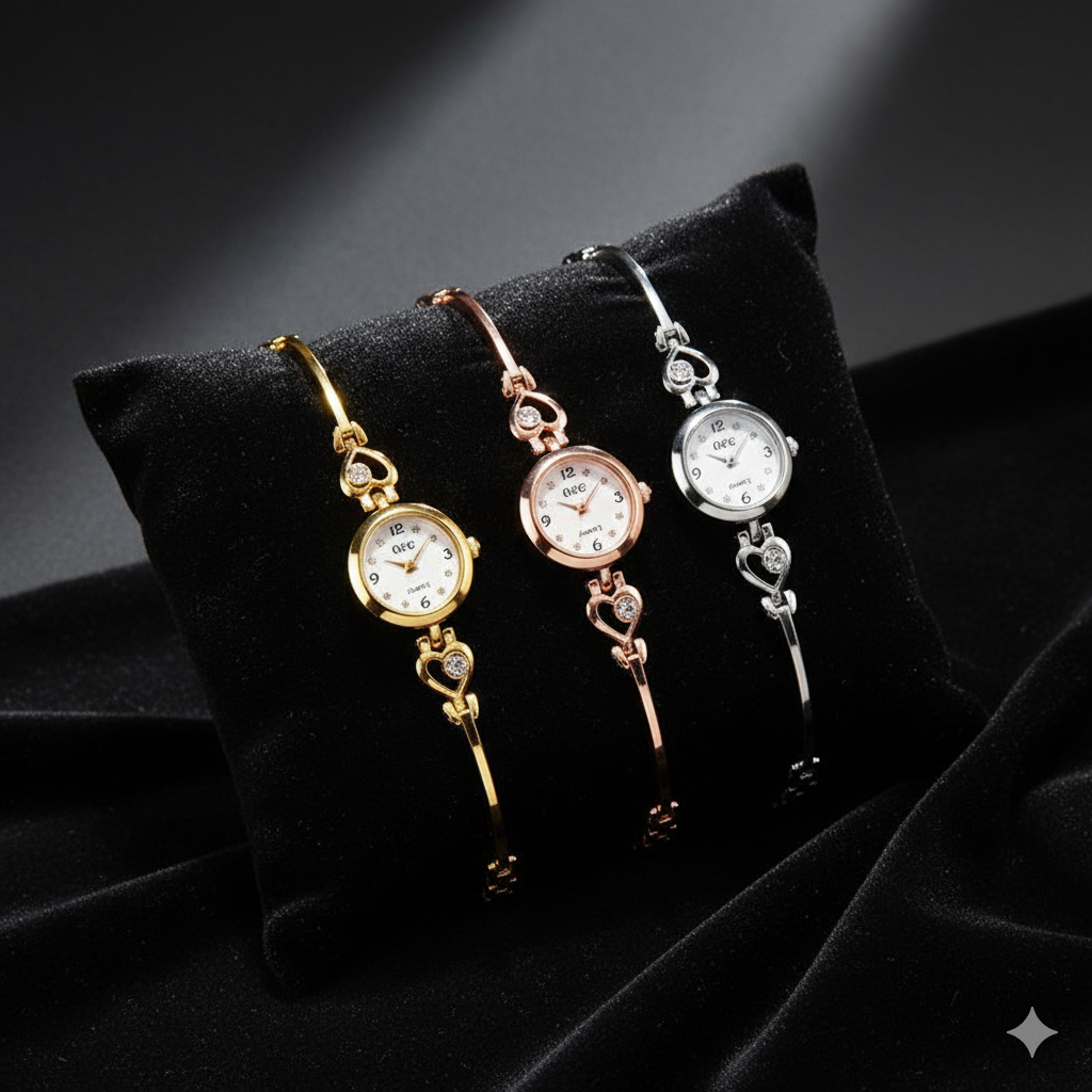 Three decorative key-shaped watches on a black cushion with a dark background