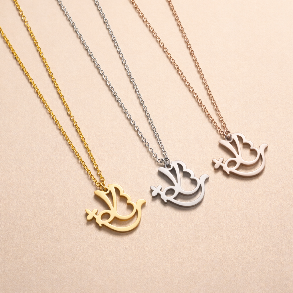 Three necklaces with dove-shaped pendants in gold, silver, and rose gold on a beige background.