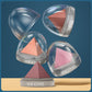 Three pyramid-shaped objects in clear domes with &