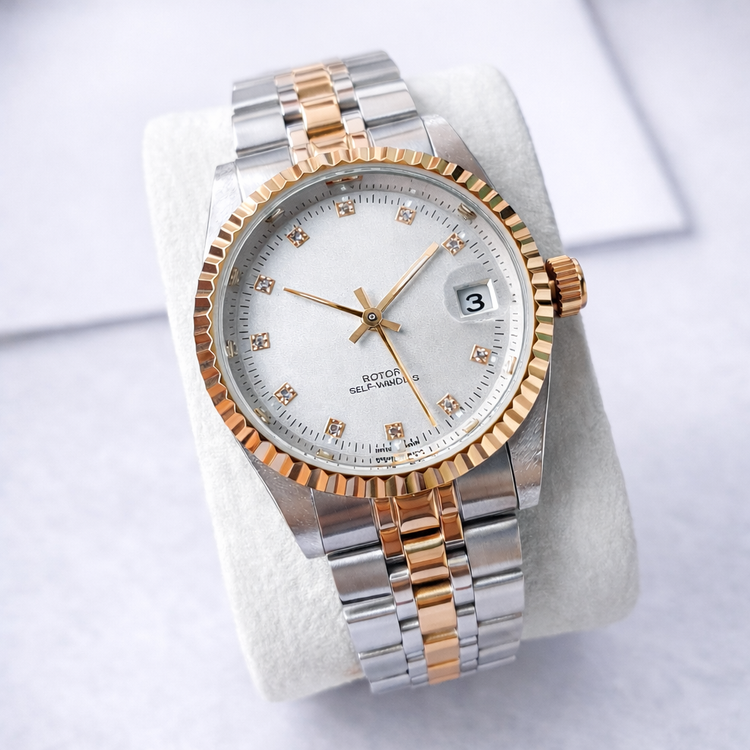 Two-tone watch with silver and rose gold band on a white background