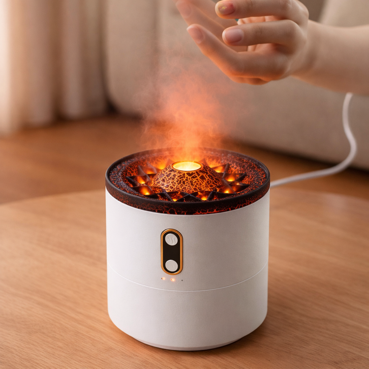 White ceramic incense burner with flames on a wooden surface, hand reaching towards it.
