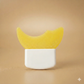 White container with yellow lid on a beige background