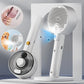 White handheld grooming tool with a brush head on a gray background
