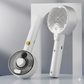 White handheld hair care device with brush and nozzle on a white background