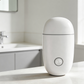 White humidifier on a bathroom counter with a neutral background