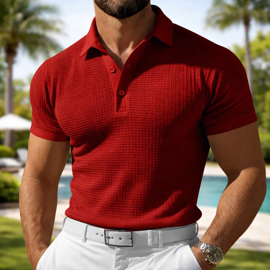 Men's waffle polo shirt - stylish solid red slim fit worn by a man standing outdoors near a pool