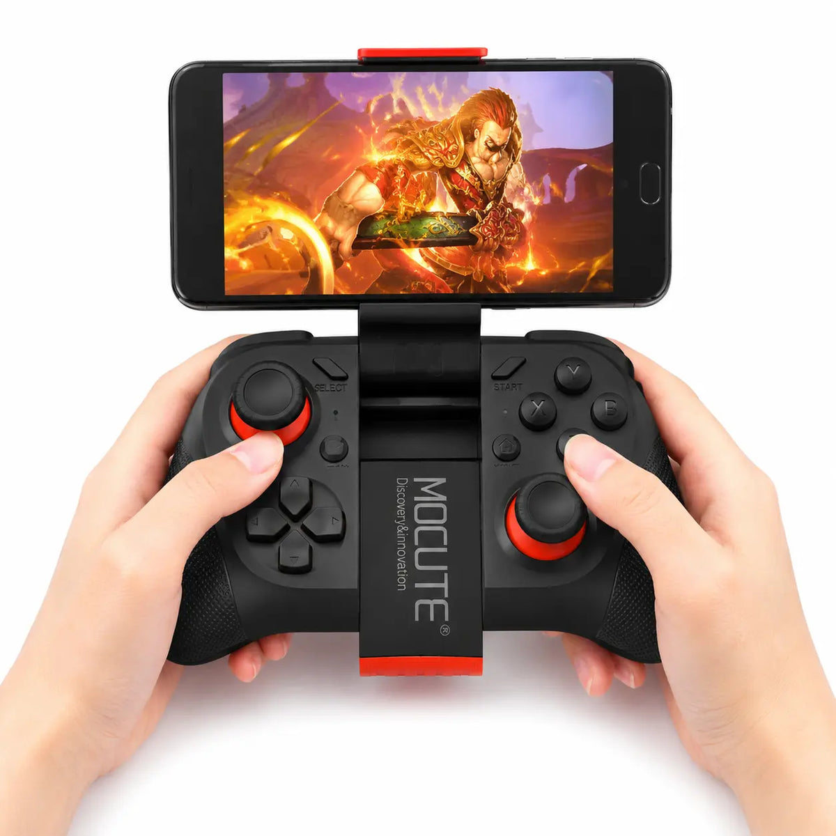 Mobile game controller black and red with hands gripping it, smartphone displaying game attached on top