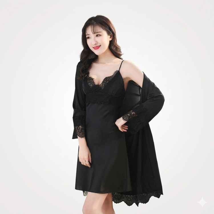 Woman wearing a black lace nightgown with a matching robe on a white background