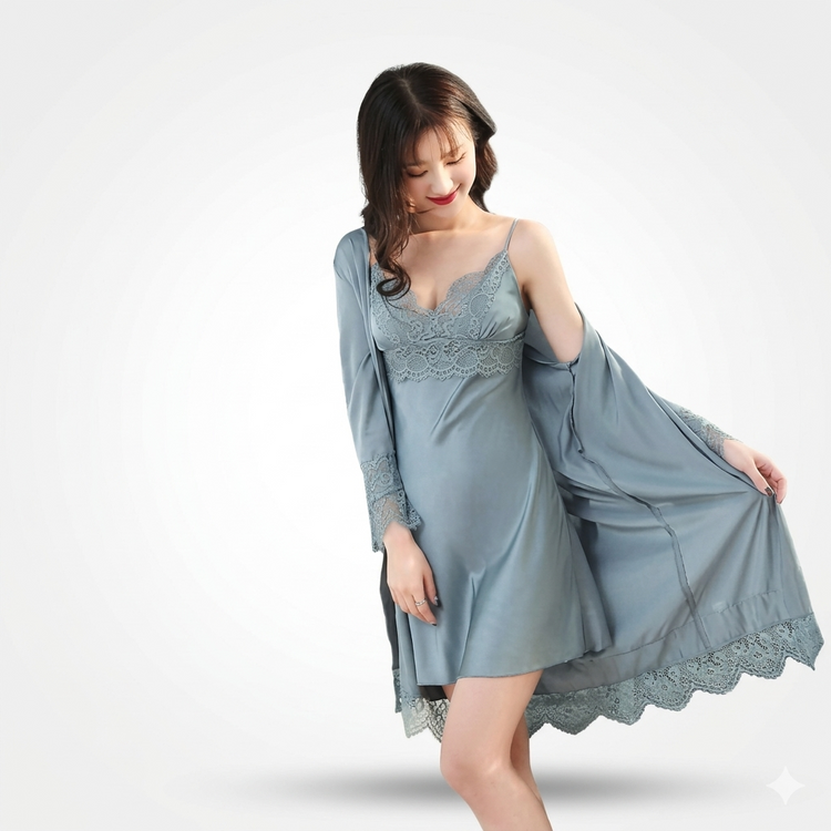 Woman wearing a light blue lace nightgown with matching robe on a white background
