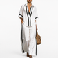 Woman wearing a white outfit with black accents on a white background