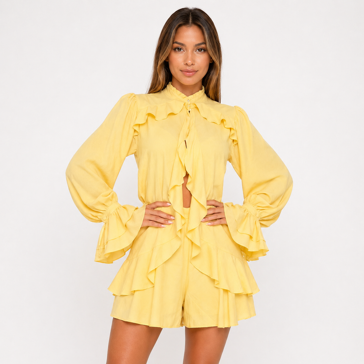 Woman wearing a yellow ruffled outfit on a white background