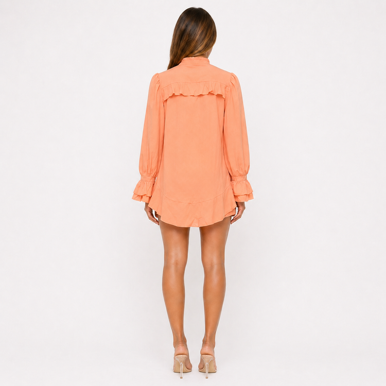 Woman wearing an orange dress on a white background
