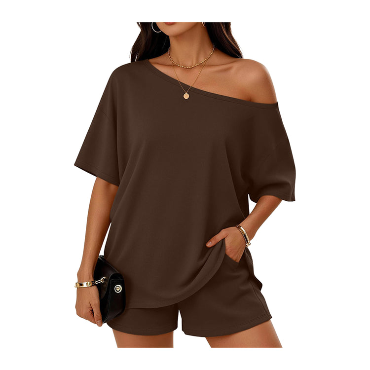 Woman wearing a brown off-shoulder top and shorts set on a white background