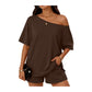 Woman wearing a brown off-shoulder top and shorts set on a white background