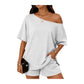 Woman wearing a gray off-shoulder top and shorts set on a white background
