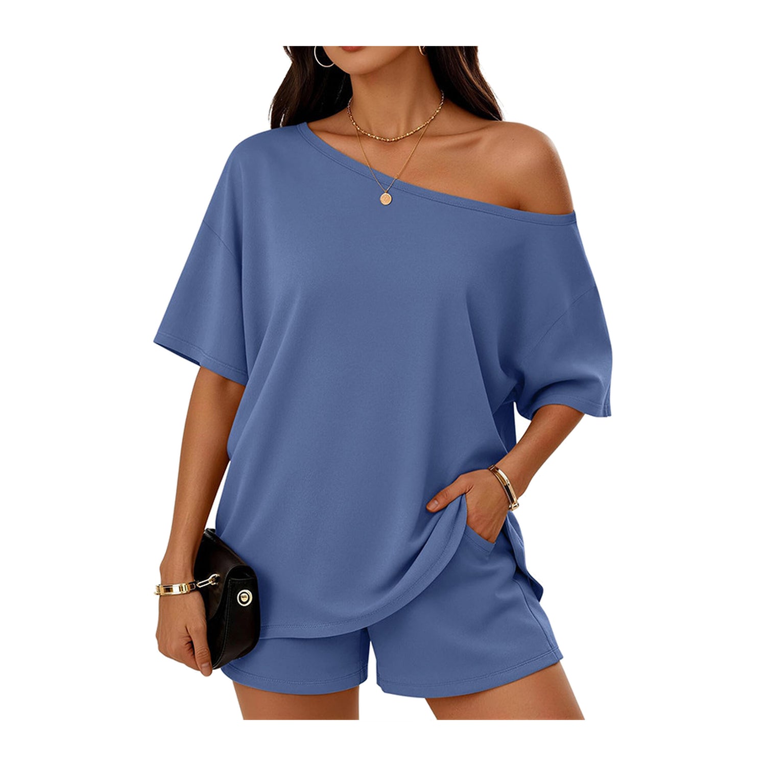 Woman wearing a blue off-shoulder top and shorts set on a white background