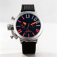 Wristwatch with black strap and orange accents on a white background
