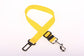 Yellow dog leash with black clip on a white background