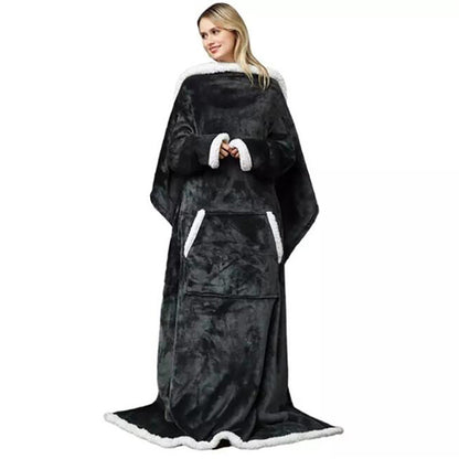 Person wearing a black and white blanket with sleeves on a white background