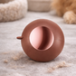 brown washable lint roller in use