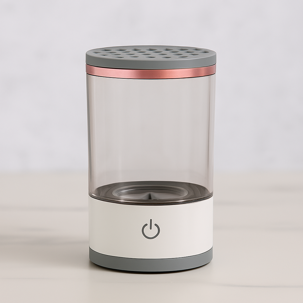 cylindrical device with clear center, gray top and bottom, and rose gold band on a white background
